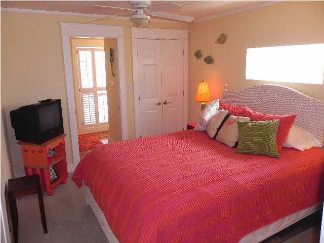 630 Blue Mountain Beach Road Santa Rosa Beach, FL 32459 - Photo 23 of 26 a bedroom with a bed and window
