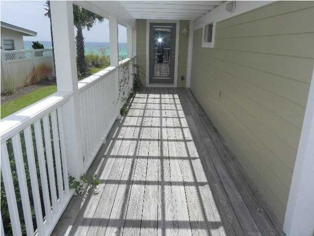 630 Blue Mountain Beach Road Santa Rosa Beach, FL 32459 - Photo 24 of 26 a view of balcony with a floor to ceiling window