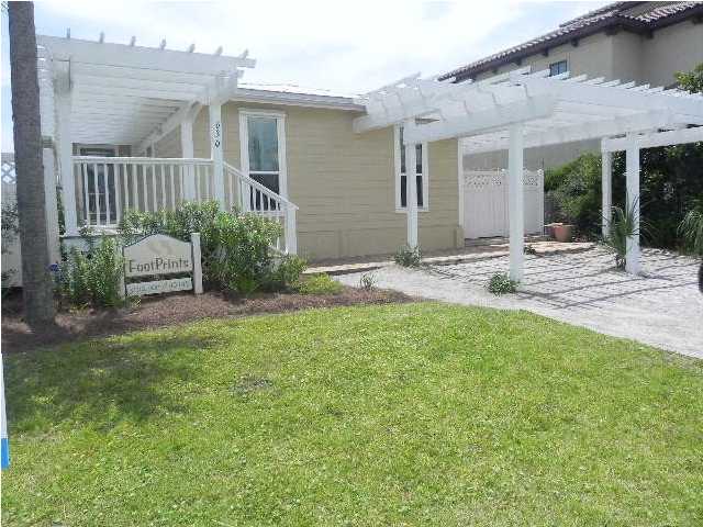 630 Blue Mountain Beach Road Santa Rosa Beach, FL 32459 - Photo 26 of 26 a view of a house with backyard and sitting area