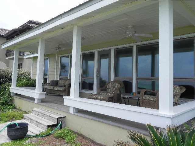630 Blue Mountain Beach Road Santa Rosa Beach, FL 32459 - Photo 5 of 26 a view of a two chairs in front of house