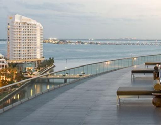 475 Brickell Avenue, Unit 910 Miami, FL 33131 - Photo 11 of 13 a view of a balcony with an outdoor seating
