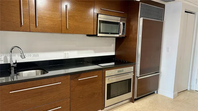a kitchen with a sink and a microwave