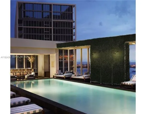 a view of a balcony with an outdoor seating