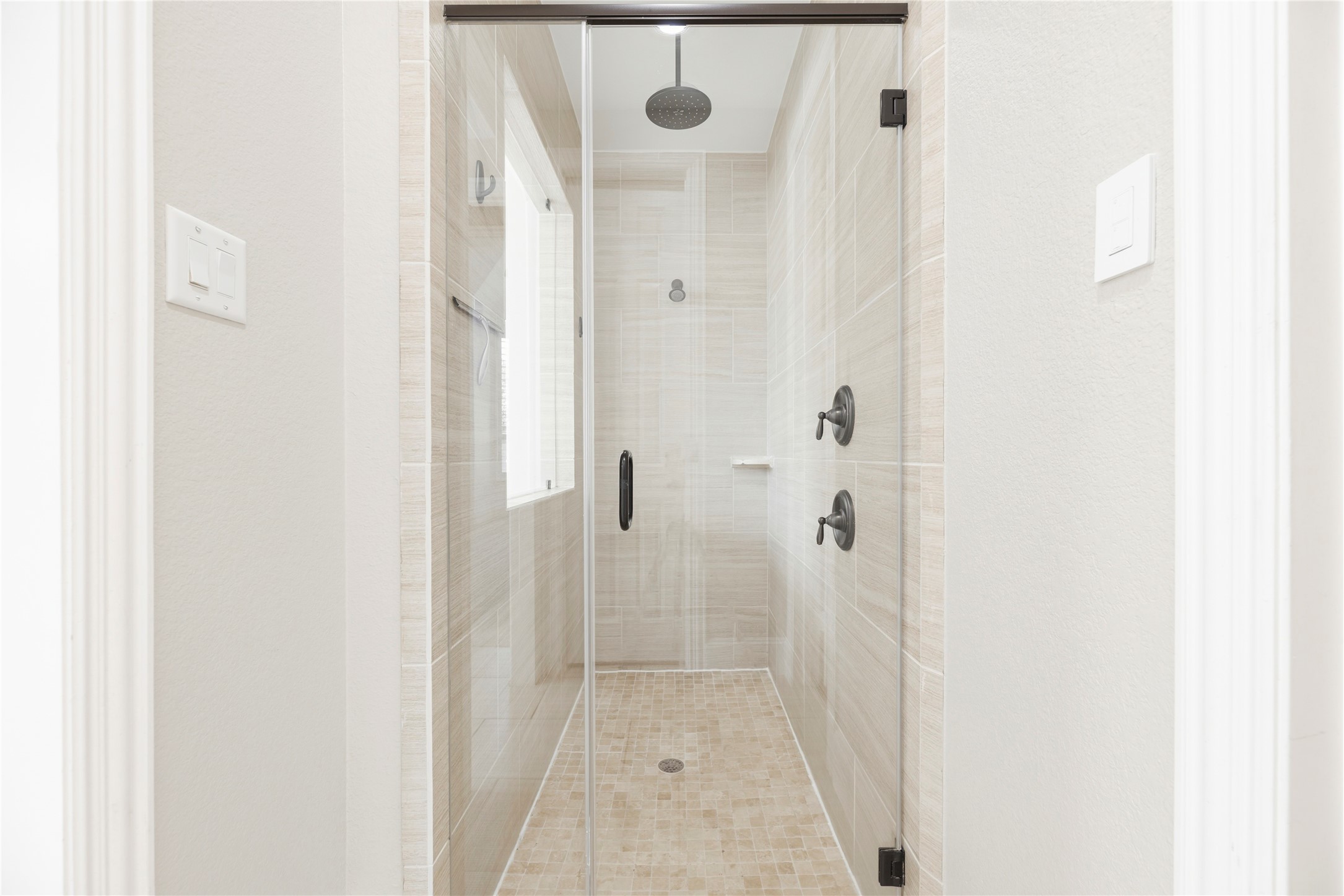 28226 South Firethorne Road Katy, TX 77494 - Photo 18 of 39 The bath is completed by a large, separate glass-enclosed shower featuring designer floor-to-ceiling tile and high-end plumbing fixtures.