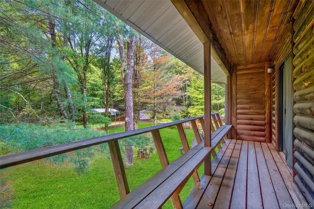 a view of balcony with wooden floor