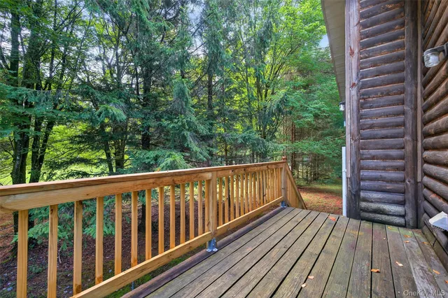 a view of balcony with wooden floor