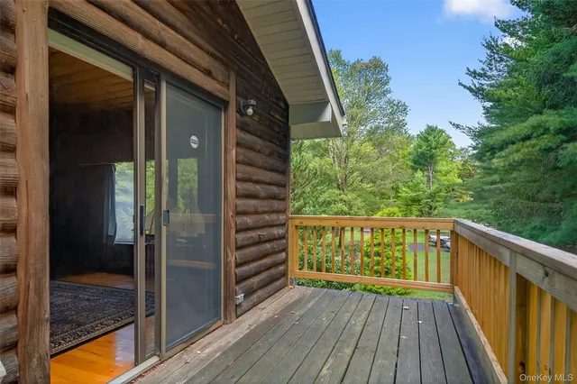 a view of balcony with wooden floor