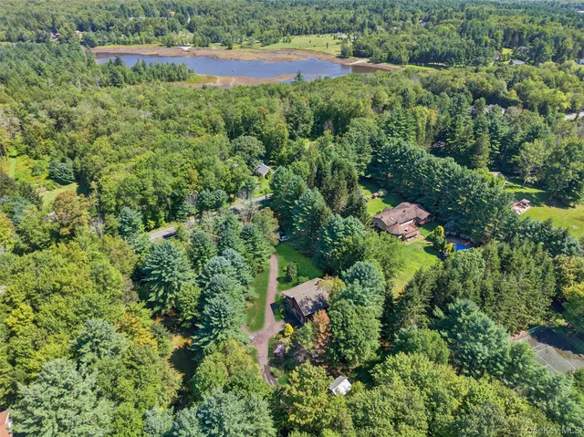 an aerial view of a house with a yard