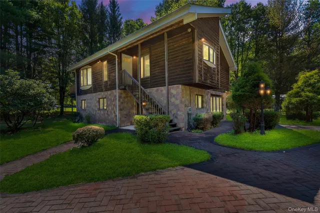 a view of a backyard with plants and a patio