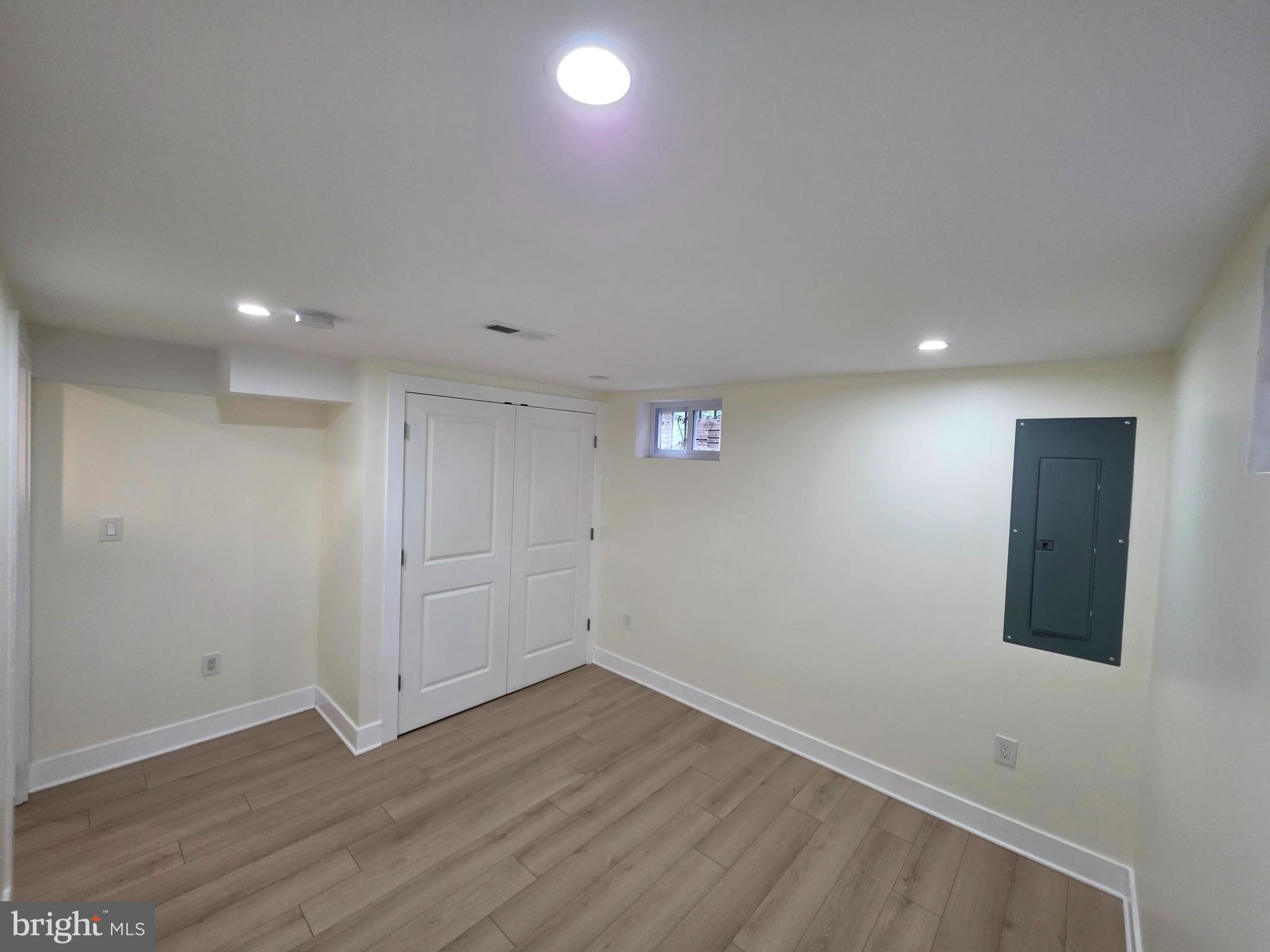 2206 Brinkley Road Fort Washington, MD 20744 - Photo 71 of 78 an empty room with wooden floor and white walls