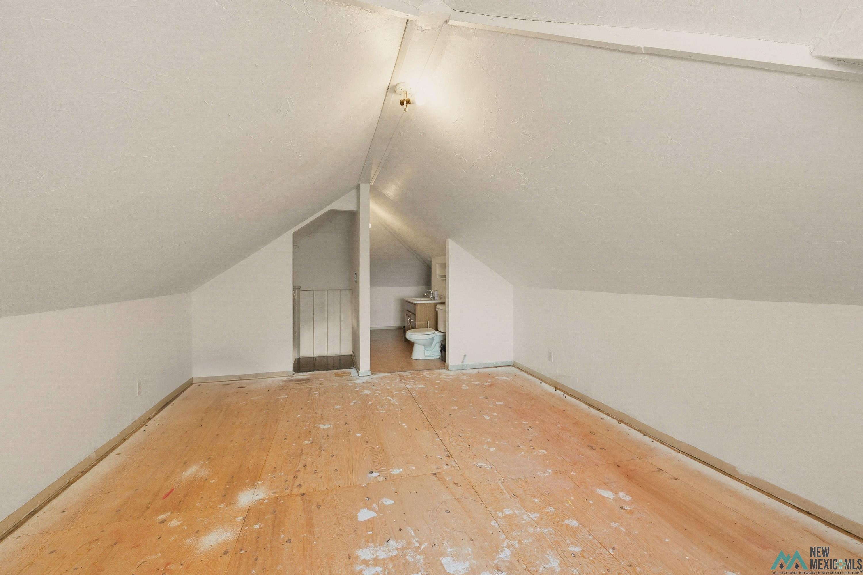1026 South 5th Street Raton, NM 87740 - Photo 19 of 33 Spacious attic area with sloped ceilings and exposed rafters