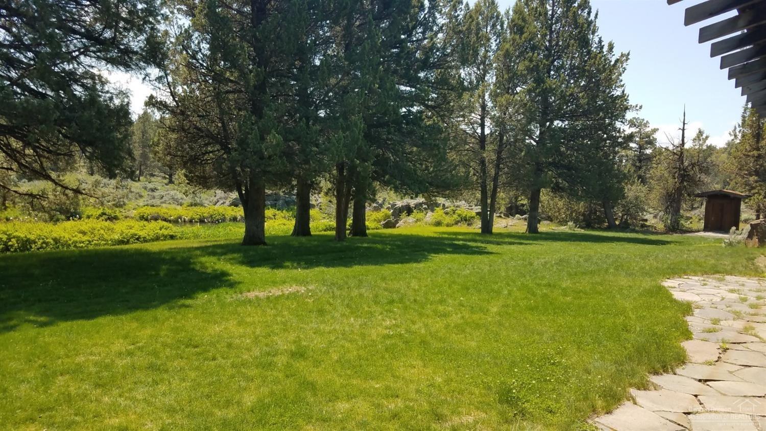 20318 Rock Canyon Road Bend, OR 97703 - Photo 13 of 15 Grassy fields by the BBQ and Fireplace n