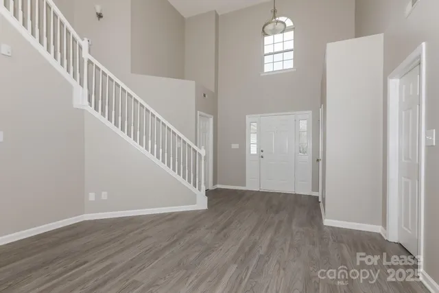 a view of an entryway with wooden floor