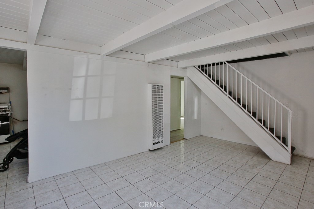 11670 Ferris Road El Monte, CA 91732 - Photo 22 of 25 a view of staircase with white walls and white walls