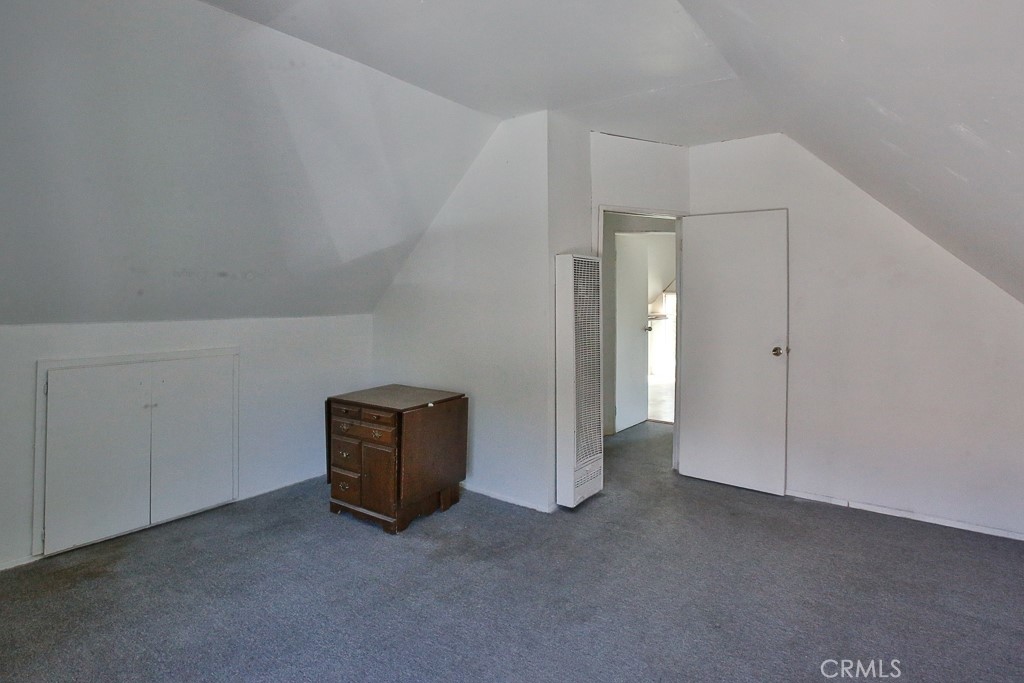 11670 Ferris Road El Monte, CA 91732 - Photo 5 of 25 an empty room with closet and cabinet