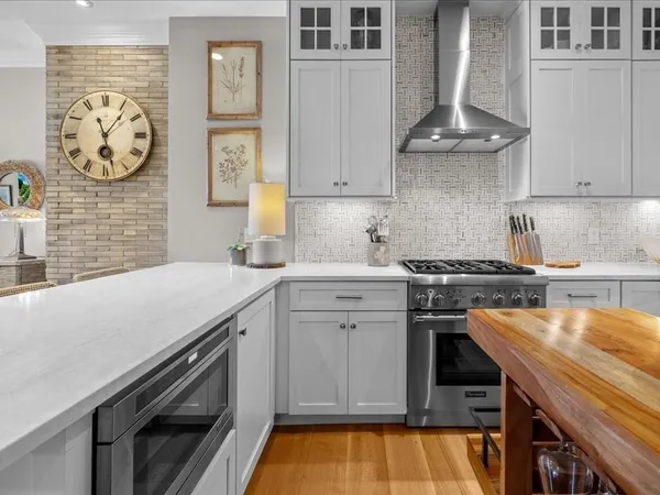 a kitchen with a stove and a sink