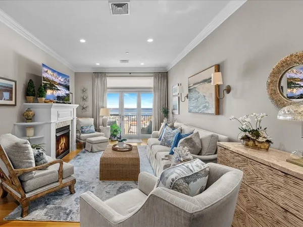 a living room with furniture fireplace and a flat screen tv