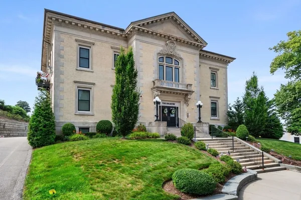 a front view of a house with garden