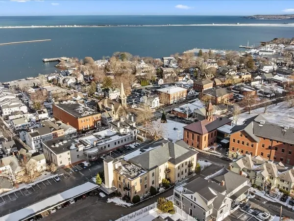 an aerial view of a house with a lake view