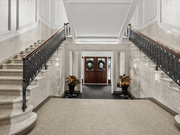 a view of staircase with white walls and stairs