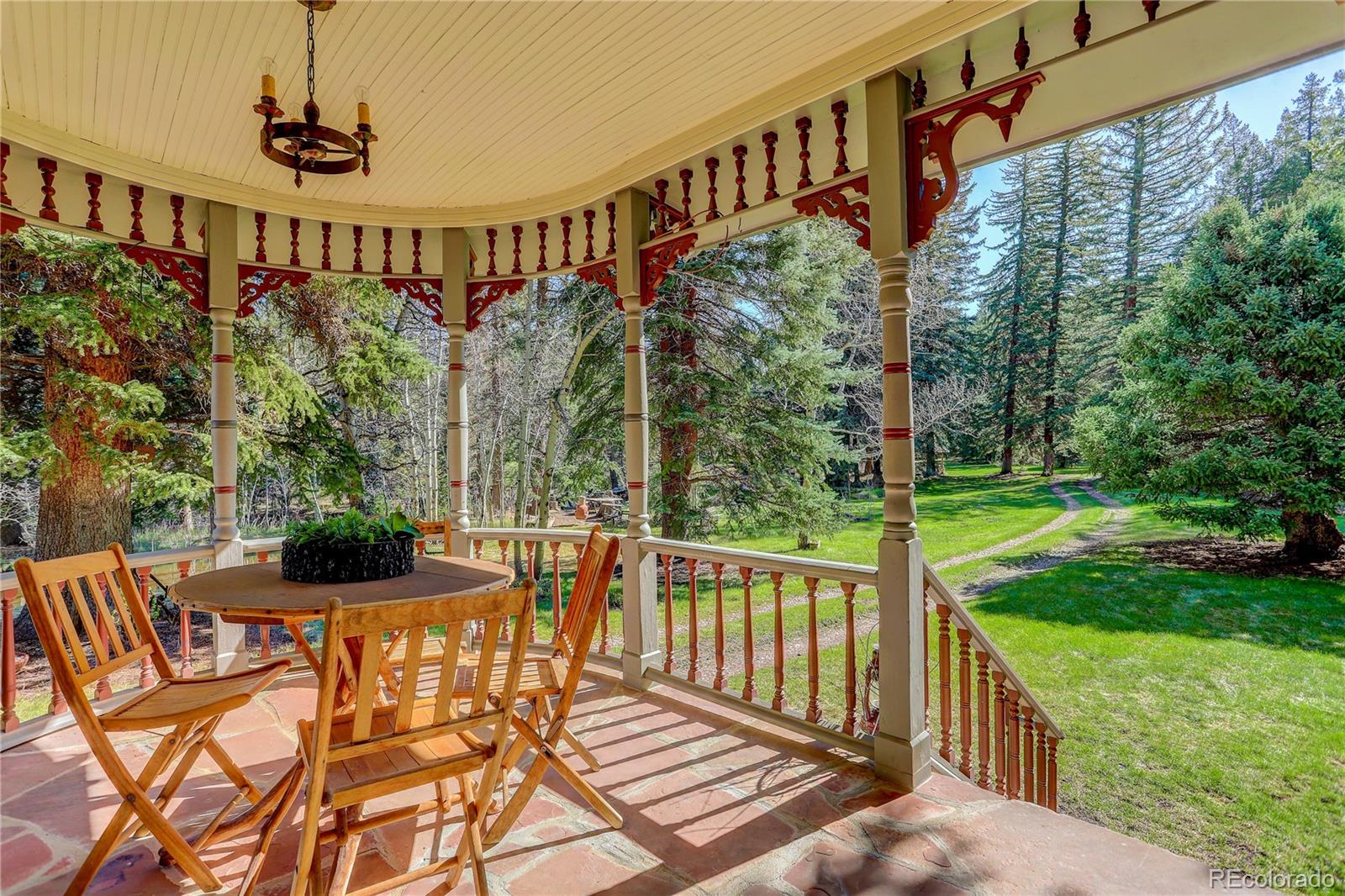 1730 Upper Bear Creek Road Evergreen, CO 80439 - Photo 13 of 40 a view of a balcony with chairs