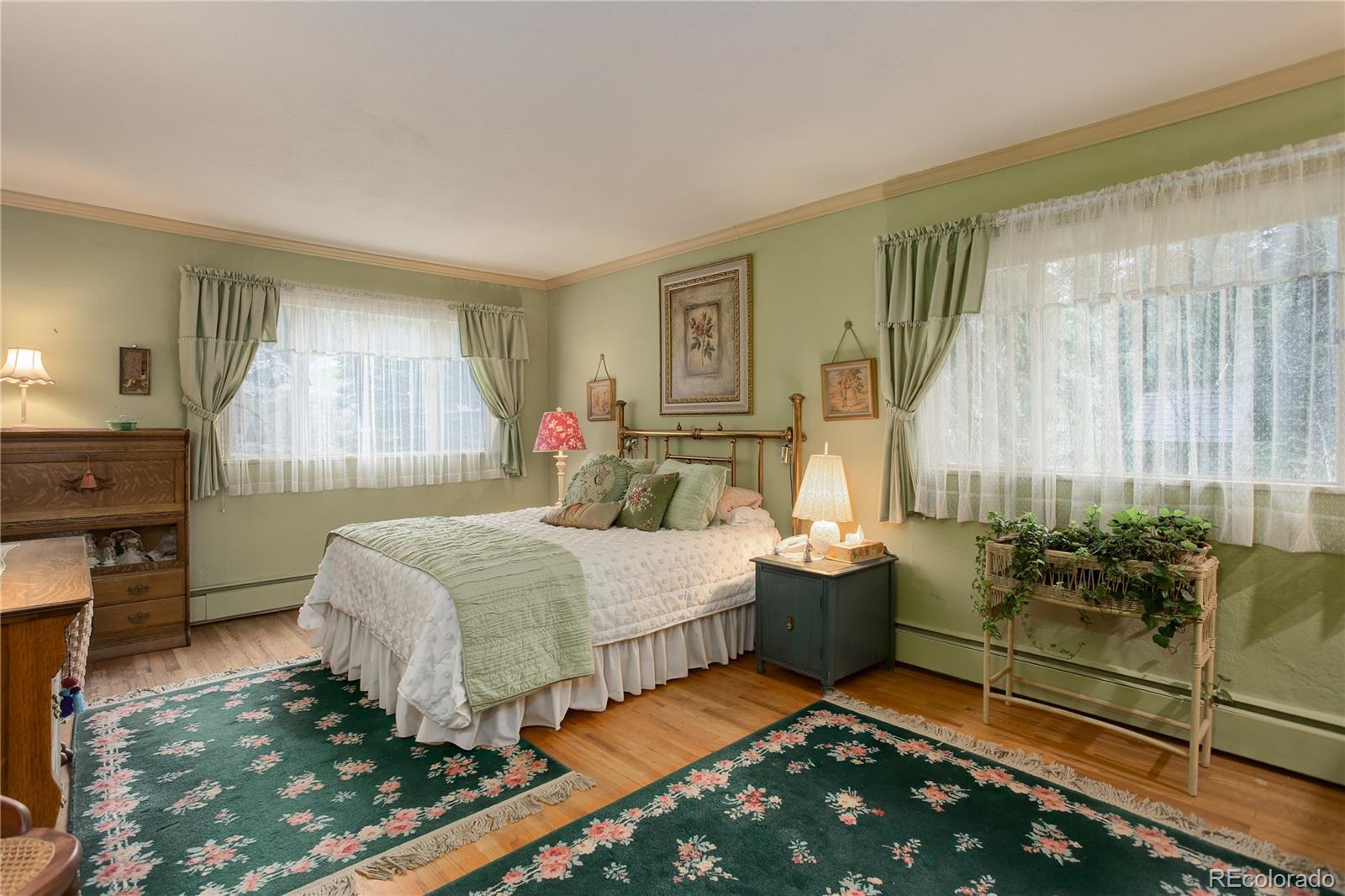 1730 Upper Bear Creek Road Evergreen, CO 80439 - Photo 24 of 40 a bedroom with double bed and a window