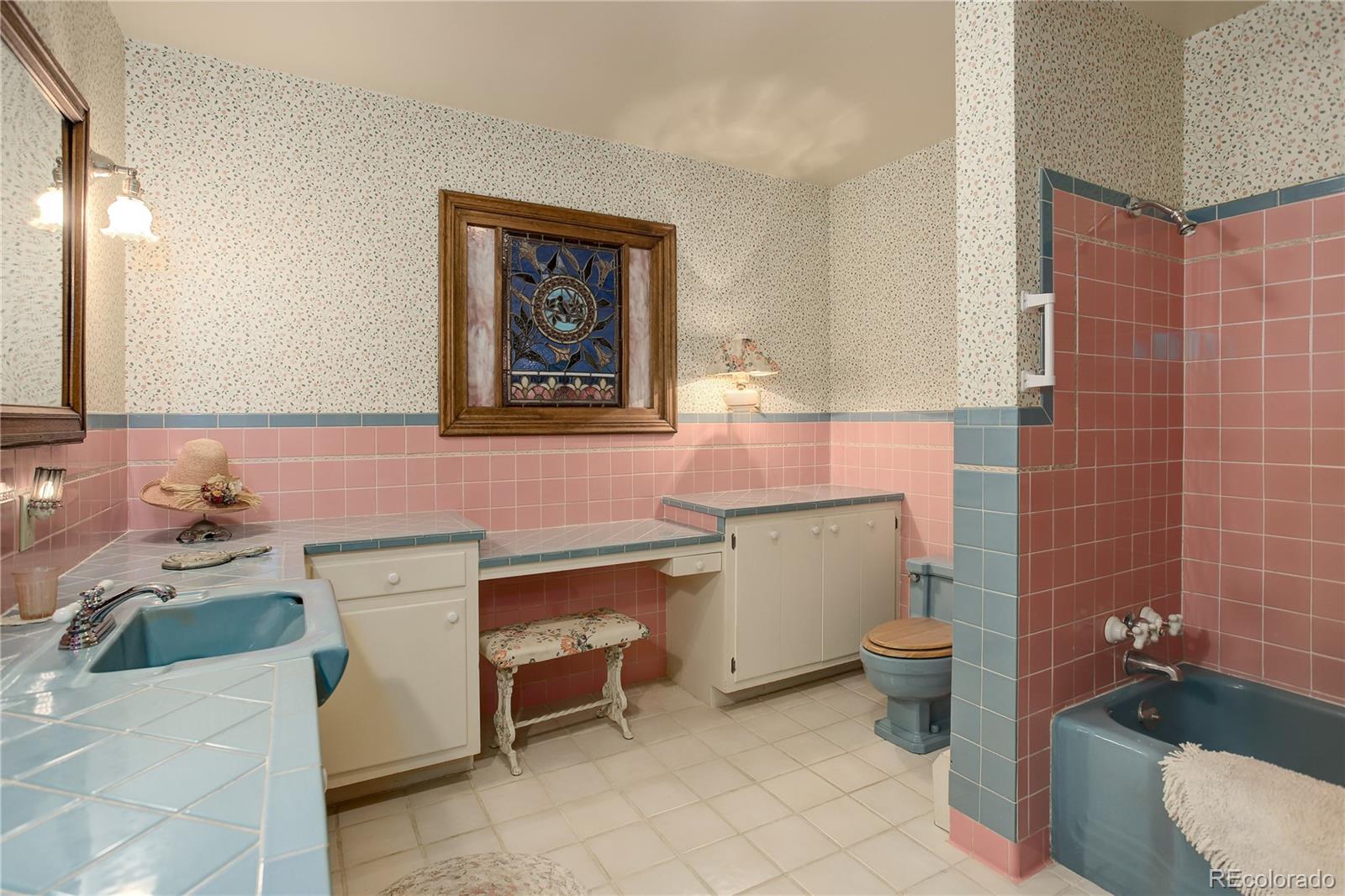 1730 Upper Bear Creek Road Evergreen, CO 80439 - Photo 26 of 40 a bathroom with a sink toilet and mirror