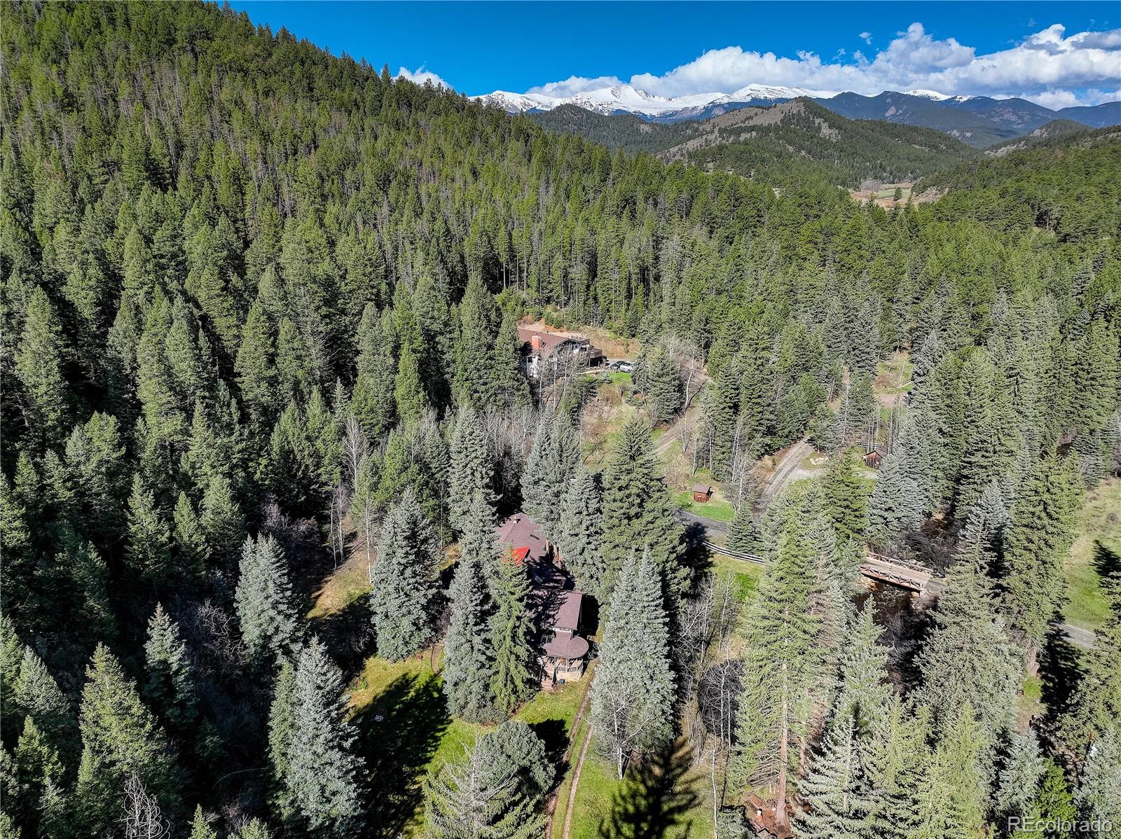 1730 Upper Bear Creek Road Evergreen, CO 80439 - Photo 33 of 40 a view of a city with a mountain
