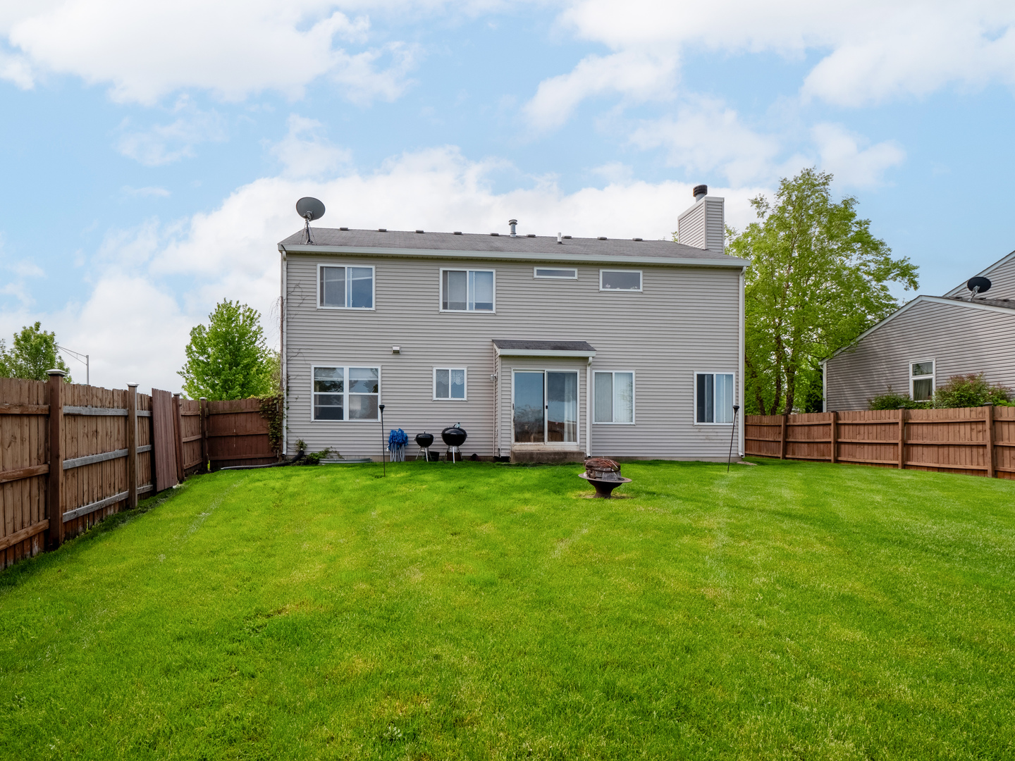26956 West Hemlock Road Channahon, IL 60410 - Photo 16 of 17 a view of a backyard with plants and a garden
