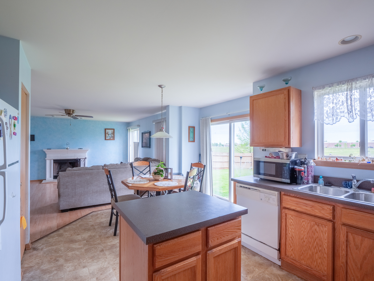 26956 West Hemlock Road Channahon, IL 60410 - Photo 8 of 17 a dining room with furniture a window and kitchen view