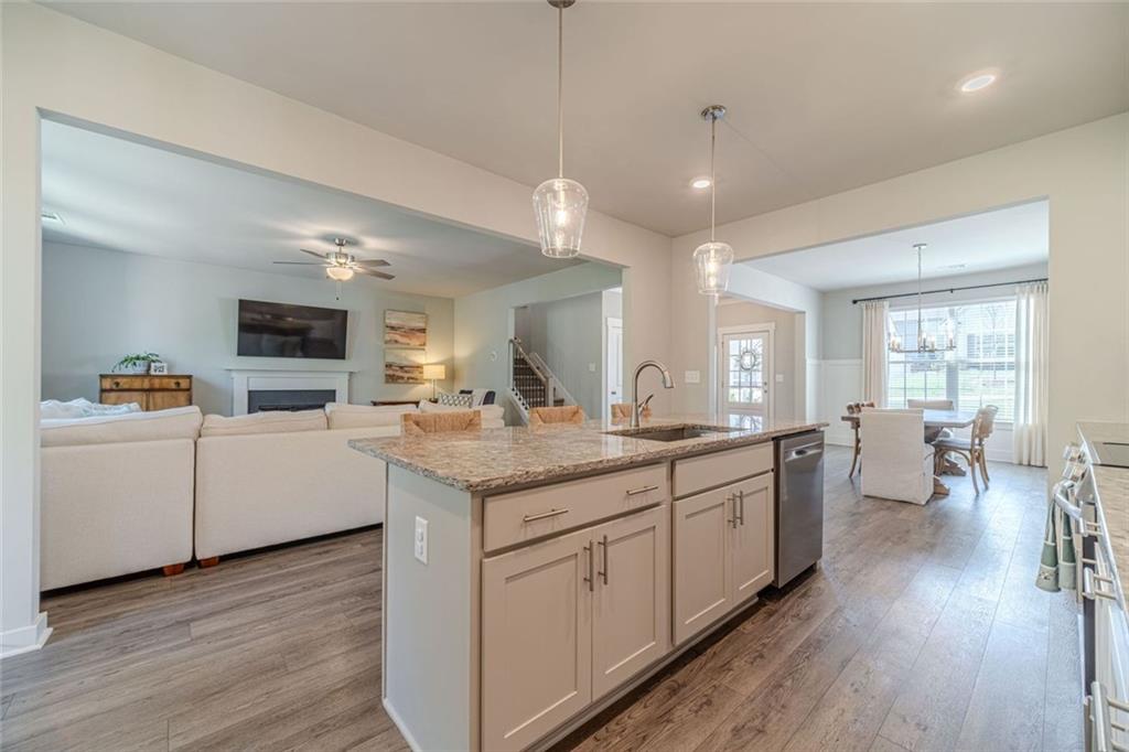 4070 Links Boulevard Jefferson, GA 30549 - Photo 13 of 46 a kitchen with sink stove and wooden floor