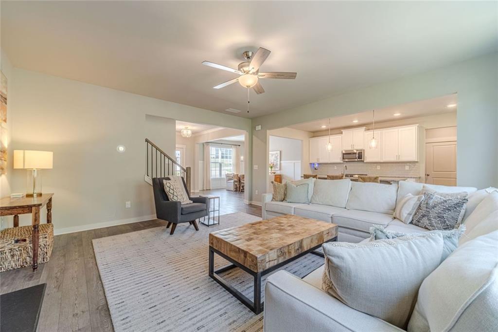 4070 Links Boulevard Jefferson, GA 30549 - Photo 17 of 46 a living room with furniture and a wooden floor