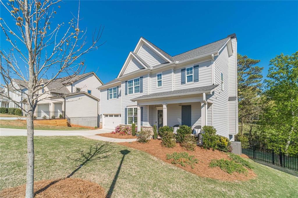 4070 Links Boulevard Jefferson, GA 30549 - Photo 2 of 46 a front view of a house with a yard