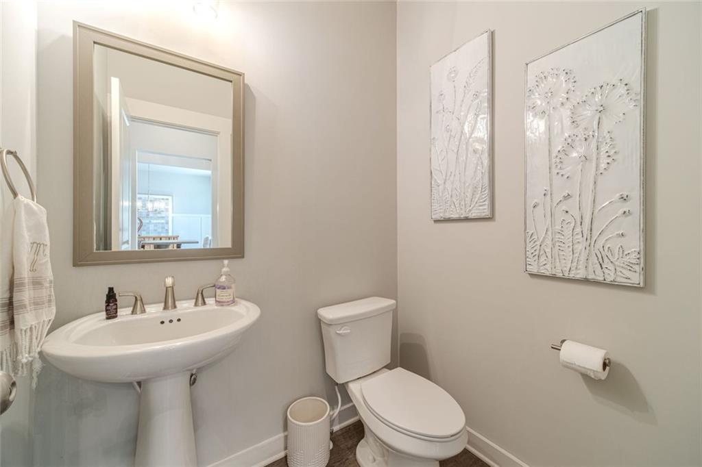 4070 Links Boulevard Jefferson, GA 30549 - Photo 21 of 46 a bathroom with a toilet sink and mirror