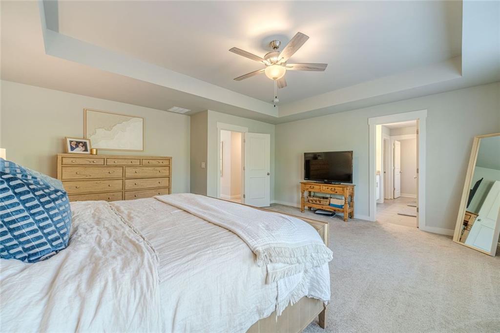 4070 Links Boulevard Jefferson, GA 30549 - Photo 27 of 46 a bedroom with a bed and a flat screen tv