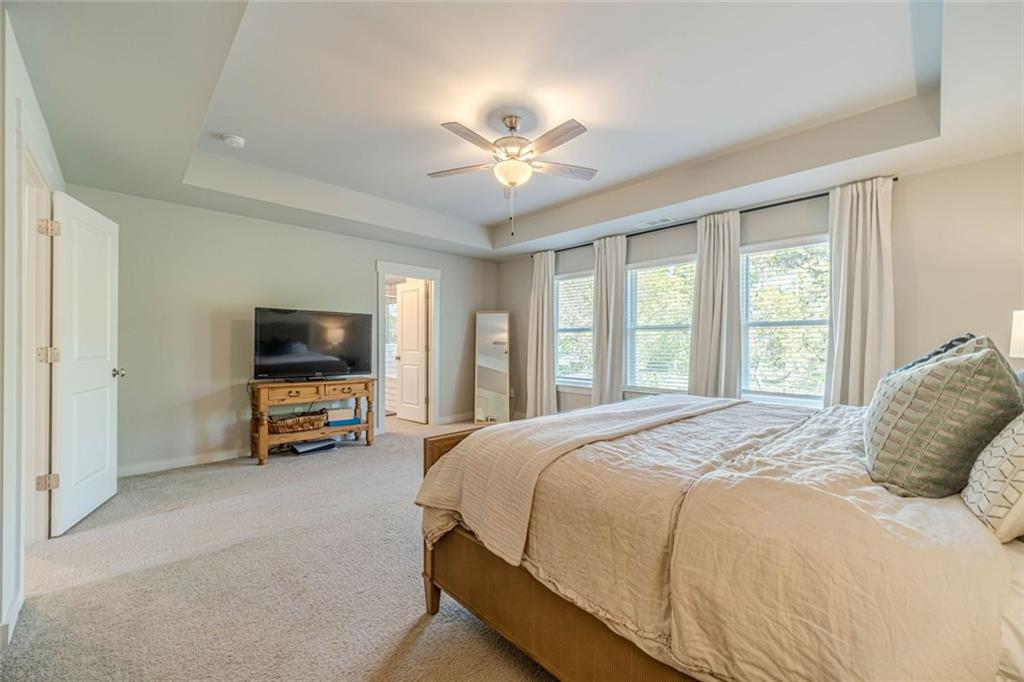 4070 Links Boulevard Jefferson, GA 30549 - Photo 28 of 46 a bedroom with a bed and a flat screen tv