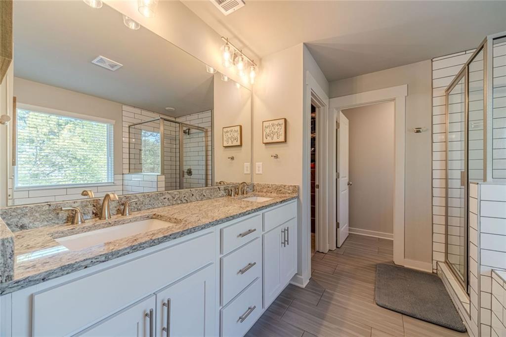 4070 Links Boulevard Jefferson, GA 30549 - Photo 29 of 46 a bathroom with a granite countertop sink mirror and double