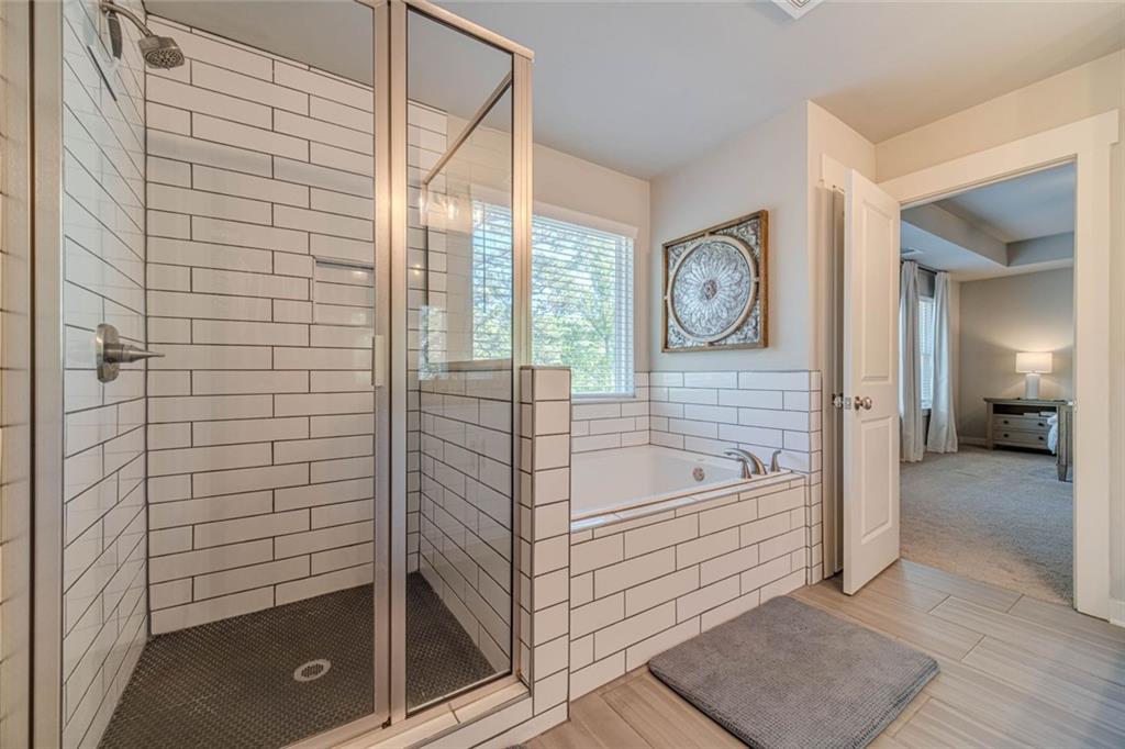 4070 Links Boulevard Jefferson, GA 30549 - Photo 32 of 46 a bathroom with a shower a mirror and a shower