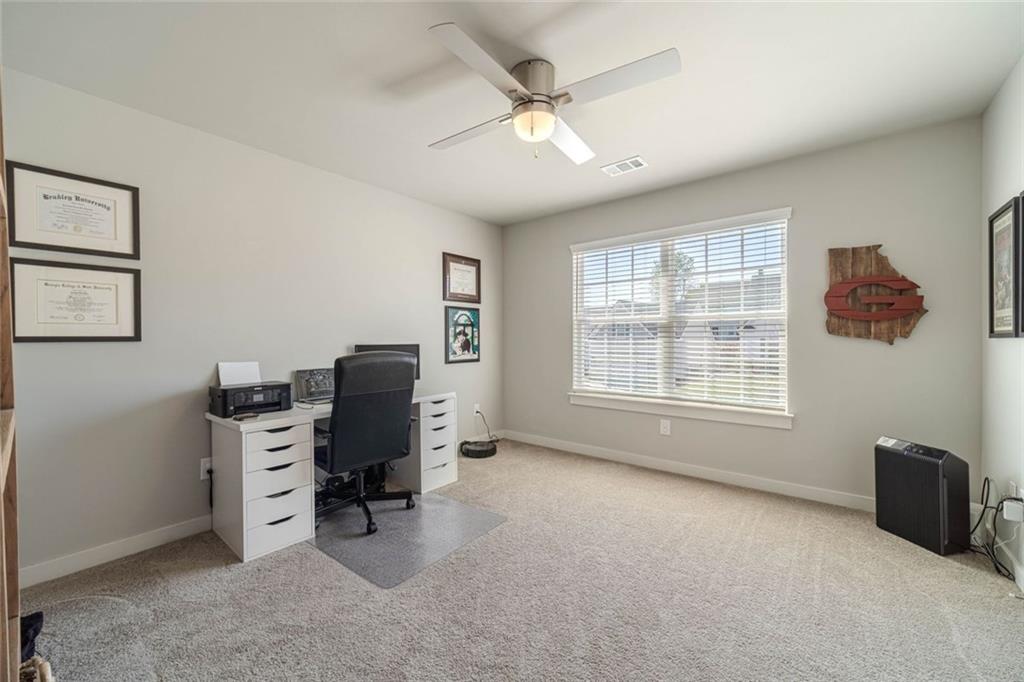 4070 Links Boulevard Jefferson, GA 30549 - Photo 38 of 46 a view of a livingroom with workspace and a window