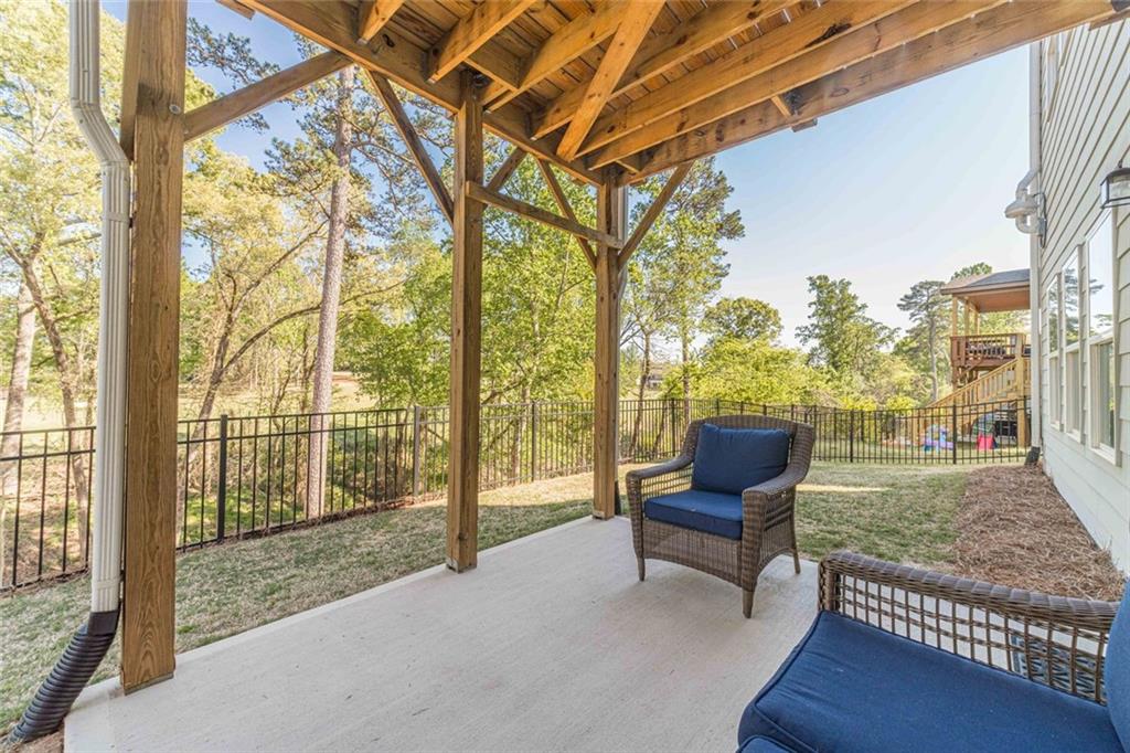 4070 Links Boulevard Jefferson, GA 30549 - Photo 45 of 46 a view of a couches in the patio with a small yard