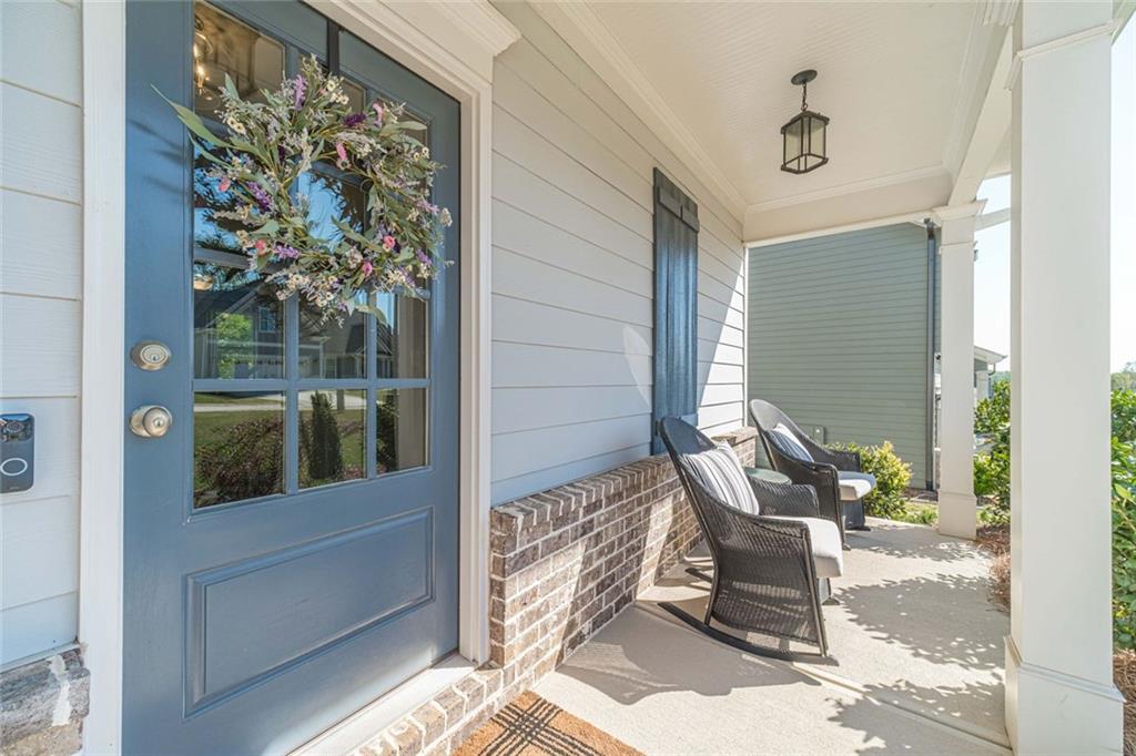 4070 Links Boulevard Jefferson, GA 30549 - Photo 5 of 46 a balcony with table and chairs