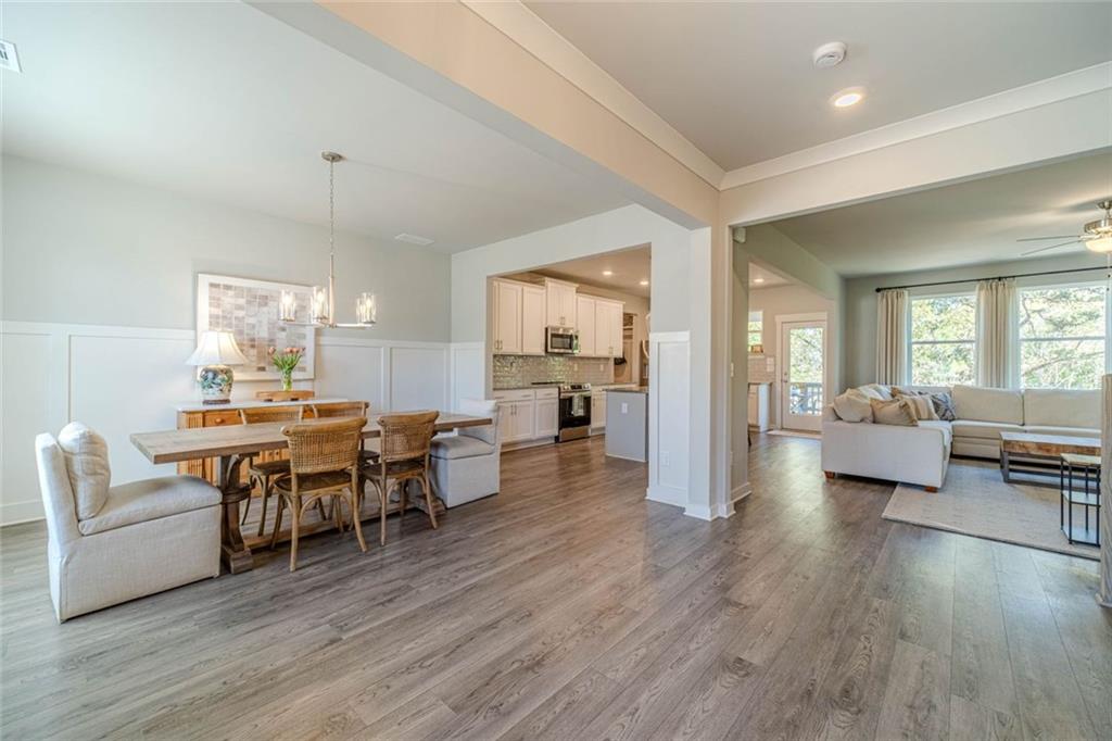 4070 Links Boulevard Jefferson, GA 30549 - Photo 6 of 46 a living room with furniture dining table and wooden floor