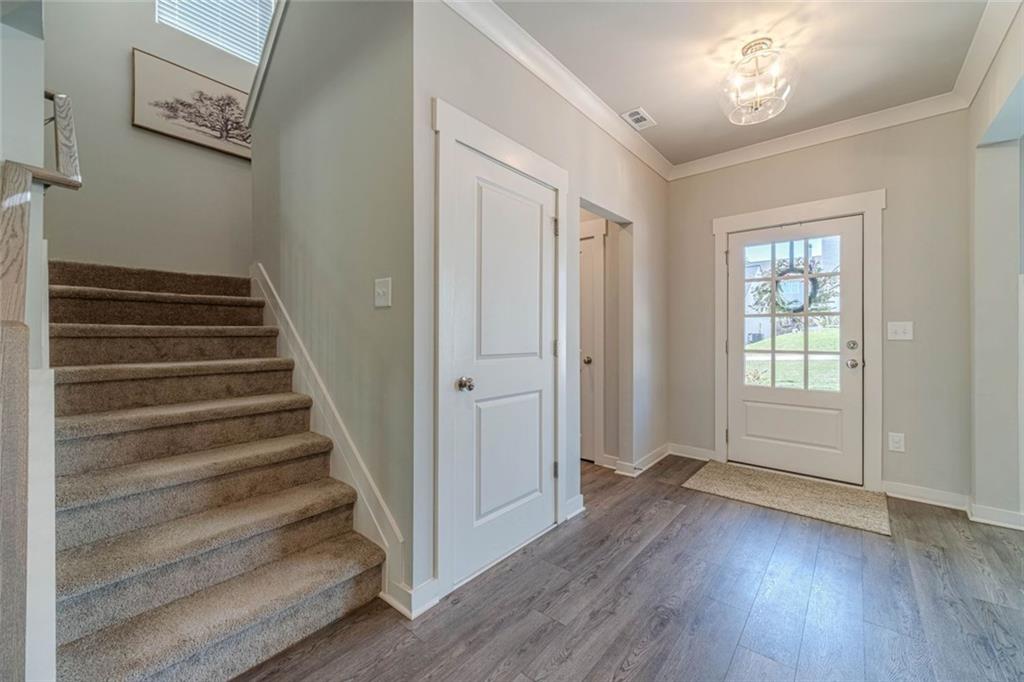 4070 Links Boulevard Jefferson, GA 30549 - Photo 7 of 46 a view of a hallway with wooden floor and entryway