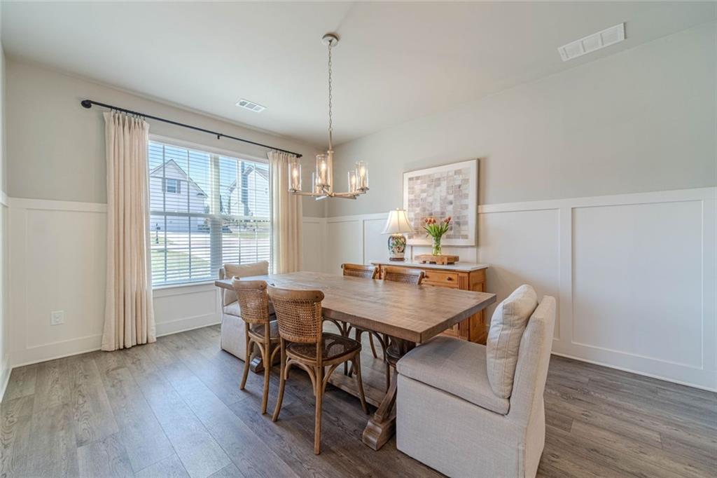 4070 Links Boulevard Jefferson, GA 30549 - Photo 8 of 46 a view of a dining room with furniture window and wooden floor