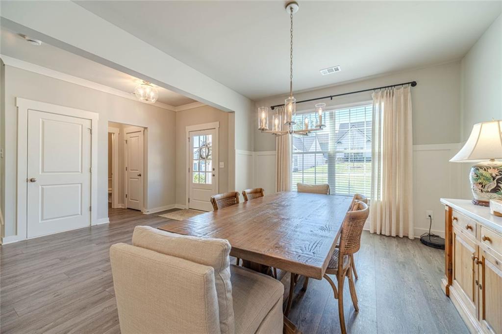 4070 Links Boulevard Jefferson, GA 30549 - Photo 10 of 46 a view of a dining room with furniture window and wooden floor