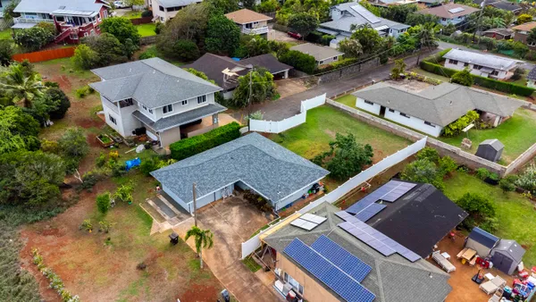 an aerial view of residential house with outdoor space and swimming pool