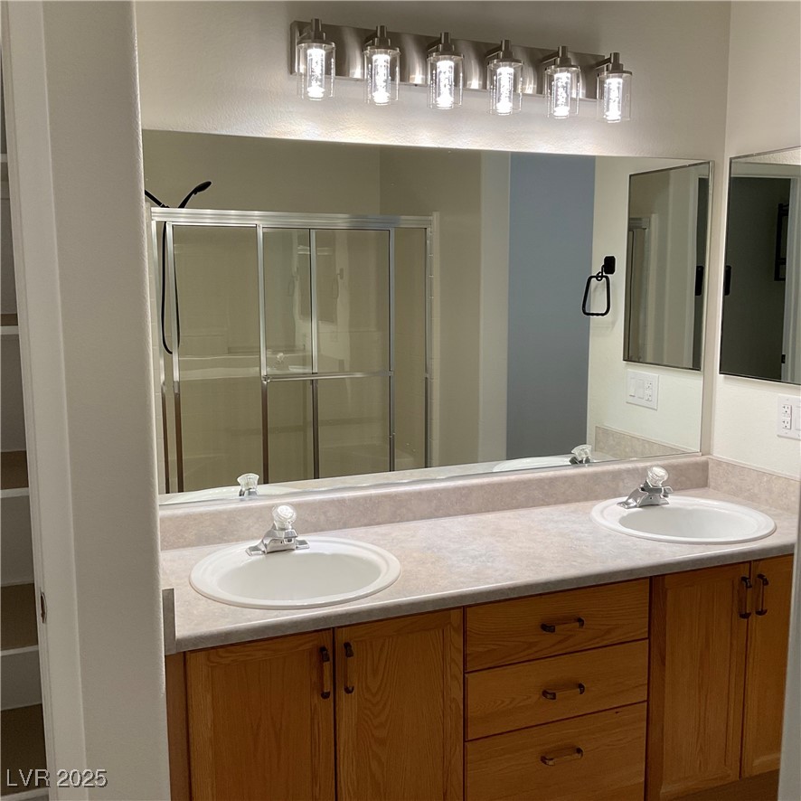 7620 Donald Nelson Avenue Las Vegas, NV 89131 - Photo 21 of 34 Full bath featuring double vanity and a stall shower