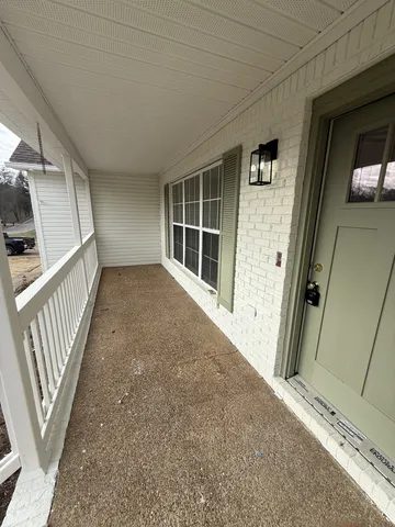 a view of a hallway with stairs