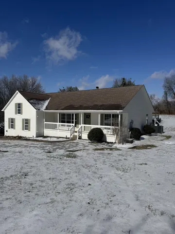 a house with trees in the background