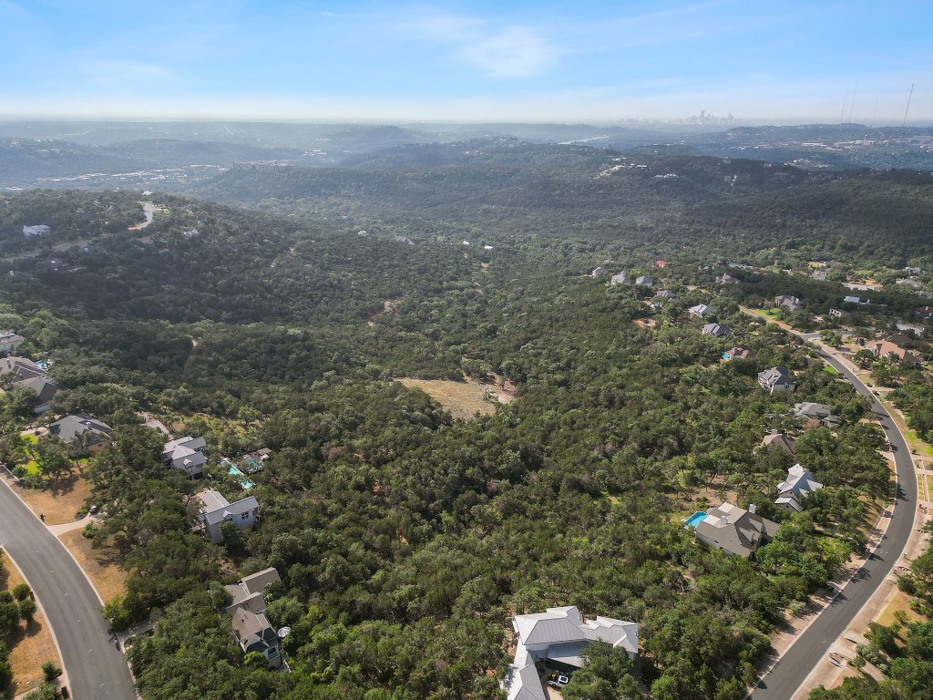 6002 Lost Trail Cove Austin, TX 78730 - Photo 13 of 28 an aerial view of house with yard and mountain view in back